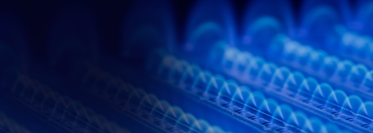 A close-up of rows of blue, glowing lights or transparent domes on a circuit board or electronic component, creating a futuristic and technological atmosphere.